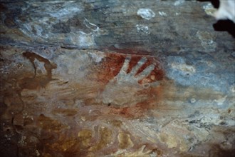 Cave painting of a hand stencil