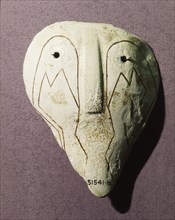 Conch shell incised with abstract face design Country of Origin: USA