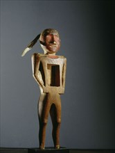 Carved wood figure with rectangular opening in the chest, used by the Midewiwin secret society