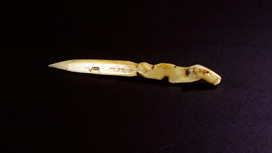 Small ivory knife with the handle carved in the form of an animal head, a caribou incised on the blade