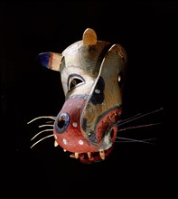Polychrome mask in the form of a stylized representation of an animal head