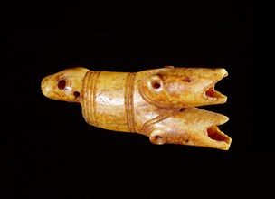 Drag handle with three heads one is a seal and the other two are probably polar bears