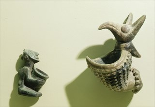 Two pipe bowls, one in the form of a kneeling human figure, the other a composite animal with beak and prominent ears