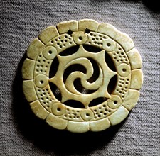 Shell gorget with spiral design in centre