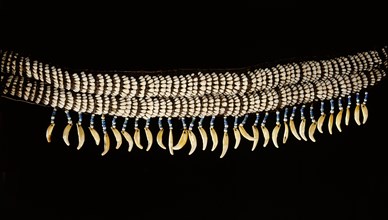 Womans belt made from caribou incisors, beads and the canine teeth of a large mammal, possibly a grizzly bear
