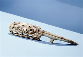 A walrus ivory object, possibly a comb to clean bear skins