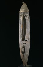 Carving from a mens meeting house representing an elongated face with long phalliform nose