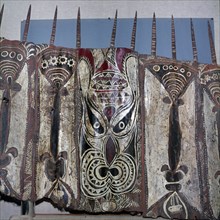 Painted sheets of bark cloth, called tapa, used as magical ornaments in ceremonial ghost houses to which only the men were admitted