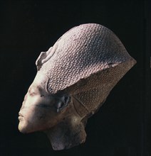 Head of Amenhotep IV ( Akhenaton ) wearing the blue crown or khepresh Country of Origin: Egypt