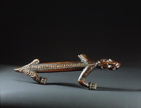 A carved lizard, probably from a storehouse roof