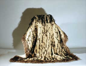 Mans cloak known as korowai, made by finger weaving of fine flax fibres and decorated with black dyed lengths of rolled fibres