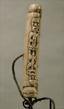 Maori bone nose flute decorated with a copulating couple