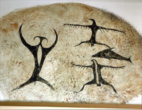 A reconstruction of an early Maori rock drawing, from a limestone shelter, of a fish with several bird like figures