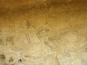 A Maori rock drawing of a man on horseback