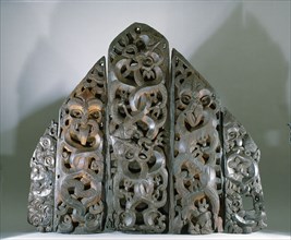 Five carved wooden end panels from a storehouse