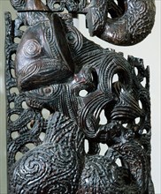 A carved wooden end panel from a storehouse