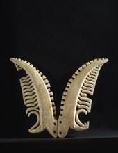 A pair of chevron pendants made from whale ivory