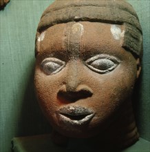 A terracotta head from the ancestral shrine of a leading member of the brass casting guild