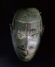 An ornamental hip mask which formed part of the regalia of important Benin chiefs