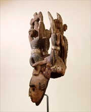 An Igbo mask of the white faced type that usually represent a beautiful girl