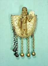 A brass pectoral ornament from the ceremonial dress of a Benin chief