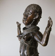 Along with two similar figures in museum collections this sculpture is a puzzling hybrid