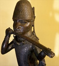 A figure of a hornblower or trumpeter such as would have been part of the retinue of important chiefs and warriors at the Benin court