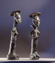 Bronze male and female figures representing the owners of the land