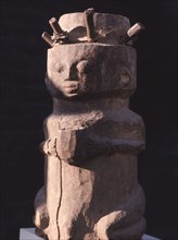 Drum in the form of a kneeling woman with an offering bowl