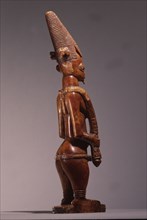 An ivory figure of a standing female which was probably a shrine figure