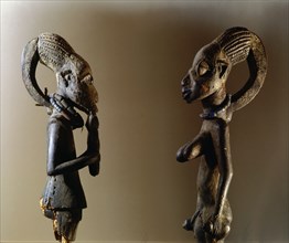 Shrine figures with the elongated hairstyle typical of the Yoruba orisha Eshu, the messenger and carrier of sacrifices to the other gods