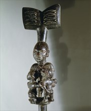 A staff used by devotees of Shango the Yoruba orisha of thunder and lightning, carried in dances when possessed by the deity