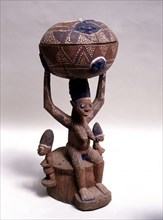 Figure of a woman supporting a large bowl