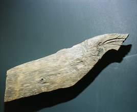 Dragons head carved on a stem fragment