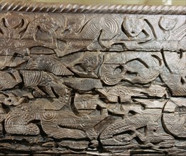 A detail of the decorative carving on the side of the Oseberg cart