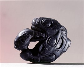 Pipe in the form of a whale chasing a seal