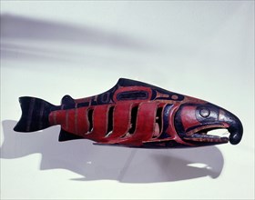 Rattle in the form of a salmon containing an effigy figure of a shaman