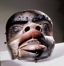 Mask depicting either a grizzly bear or a land otter