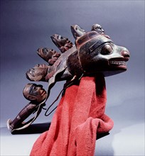 Headdress with seal mask said to have been used in a dance which preceded the execution of condemned prisoners (represented by the five anthropomorphic figures)