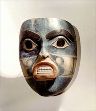 Wooden mask of a woman wearing a labret