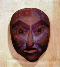 Wooden mask in the form of a human face