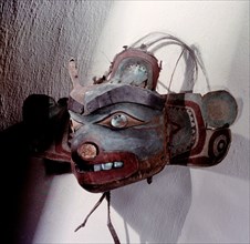 Mask; the eyebrows are made of copper strips and the ears, eyes and teeth are inlaid with haliotis shell