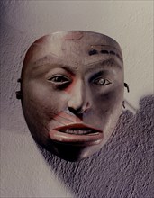 Shamans mask in the form of a womans face with inset mouth