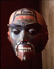 Mask with a realistic depiction of a male face, with inserted teeth and painted decoration