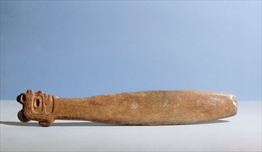 Flat bladed whalebone club with the handle carved as a head