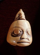 Bone carving in the form of a head