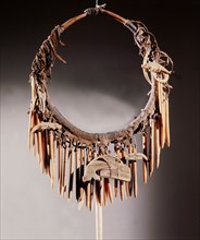 Part of a Haida shamans gear included a neckring from which various bone charms were suspended