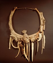Part of a Haida shamans gear included a neckring from which various bone and ivory charms were suspended