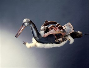 Shamans rattle in the form of a oyster catcher, with a shaman on its back