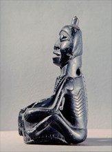 Stone human figure bowl, thought to have been used by Salish shamans in purification rites as part of ceremonies marking the onset of female puberty